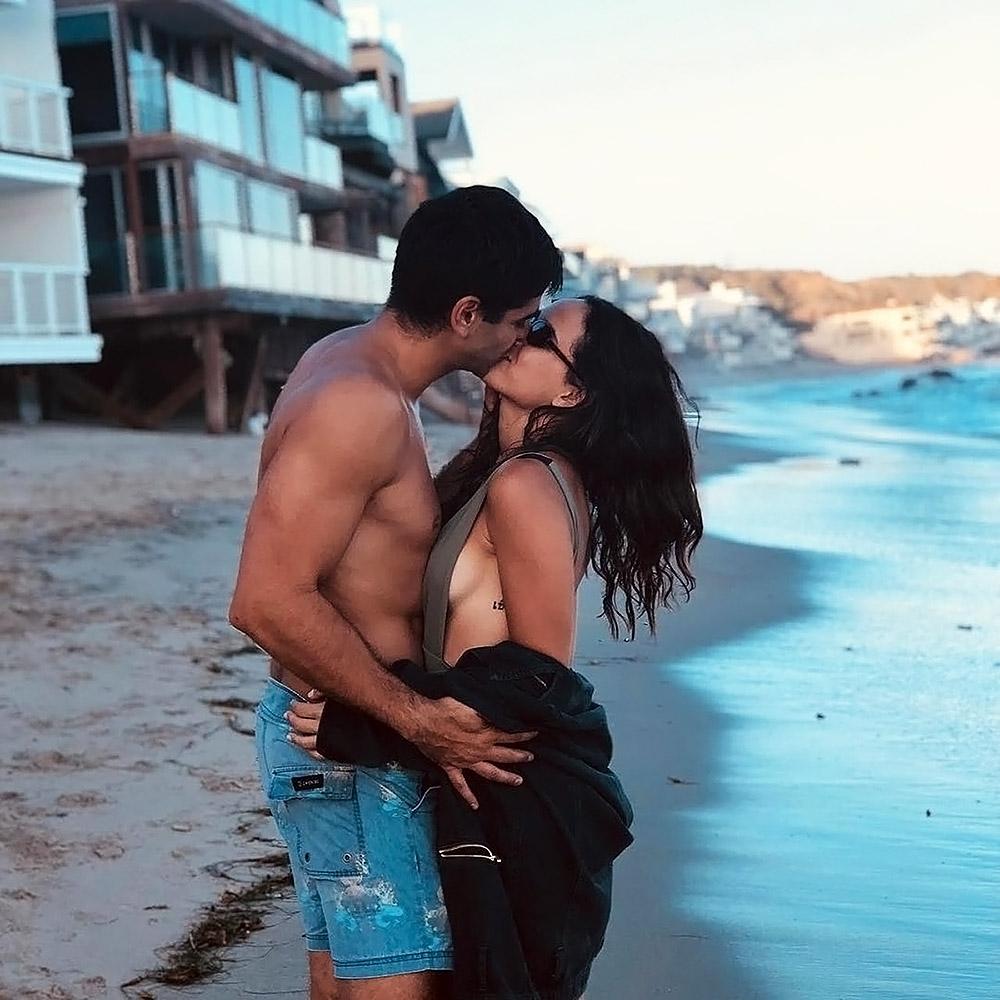Adria Arjona kissing a boyfriend