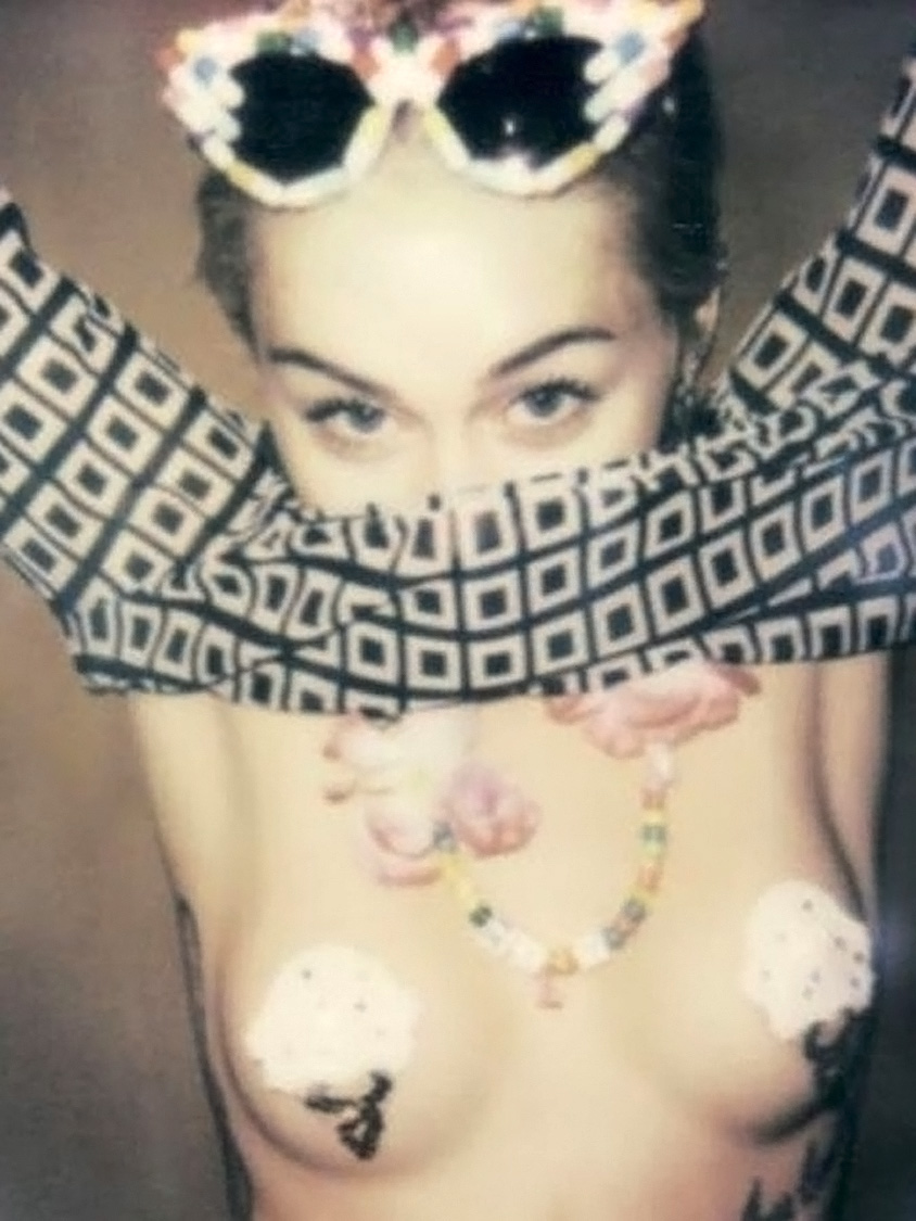 Miley Cyrus covered nipples