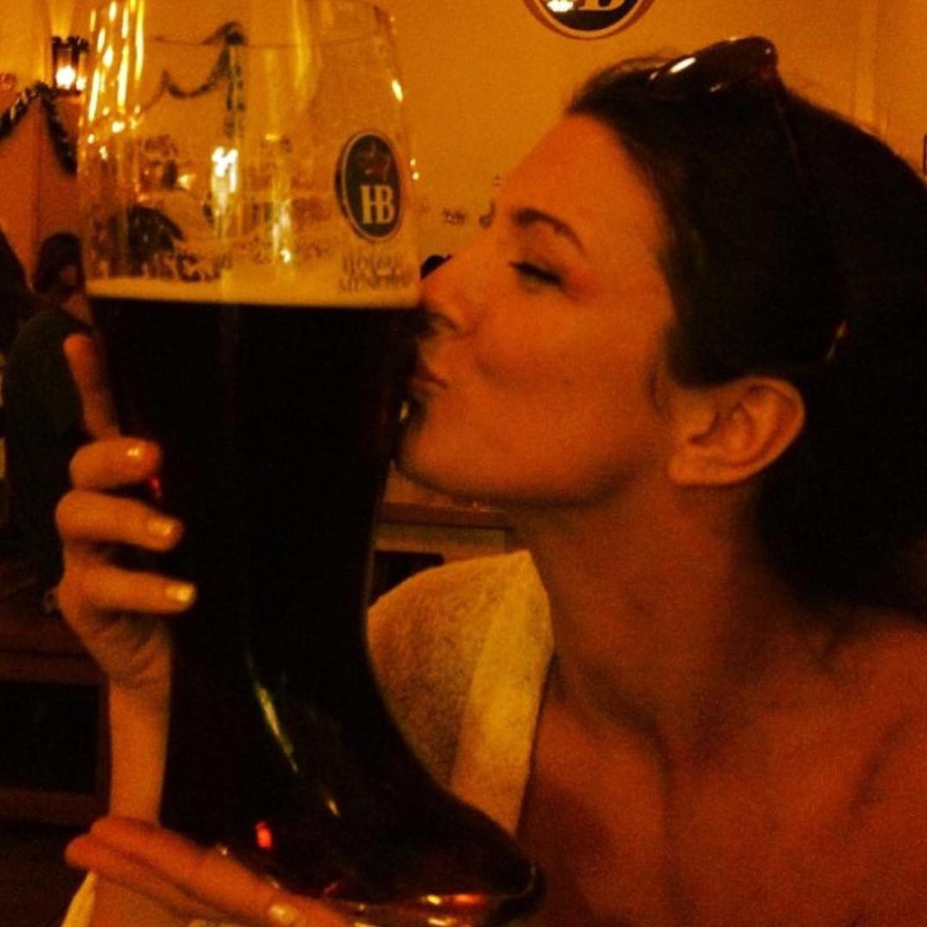 Gina Carano kissing beer
